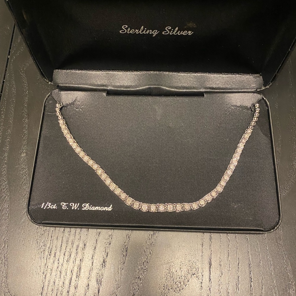 New I/3 carat genuine diamond necklace. Beautiful, never worn.